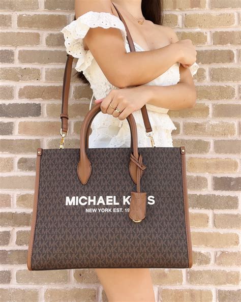 michael kors ew signature tote brown|Michael Kors embossed tote.